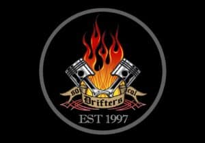 Logo of Drifters Car Club with flames and pistons, established 1997.